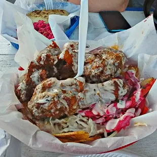 Their fried chicken w/a mountain of shredded cabbage &amp; fried plantains. Priciest @$9 but just this by itself was more than plenty!