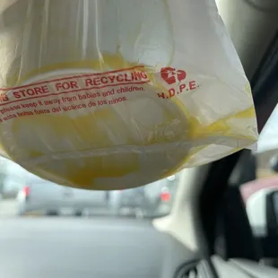 Butter at the bottom of my to go bag, my corn was drowned in butter causing it to overflow into my to go bag.