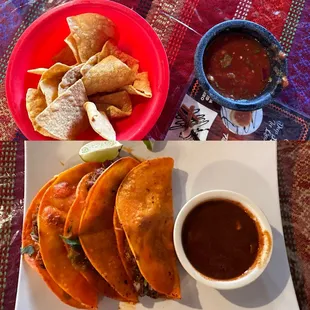 a plate of quesadillas and a bowl of salsa