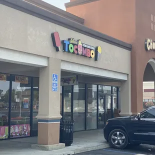 a car parked in front of a store