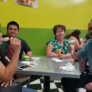 a group of people eating at a table