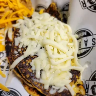 cheese on top of a tortilla