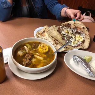 (Left) Beef soup with some potatoes,cabbage,corn and other veggies with side of rice, corn tortillas Top right baliadas with everything