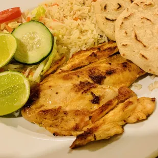 Meat Entree: Pechuga (chicken) with rice, a small salad, and two handmade fresh corn tortillas. Delicious! Hot and Fresh!