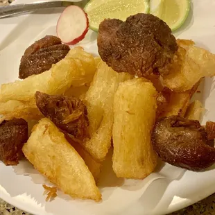 Appetizer: Fried Yuca &amp; Chicarron and two lime pieces. Very Fresh and Hot! It is very delicious! I recommend this amazing plate!