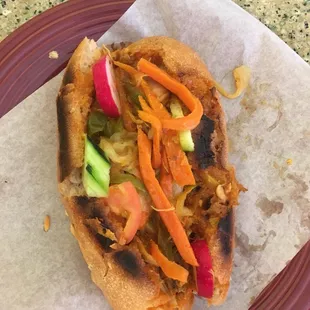 Pan con Gallina . Bread stuffed with hen. Radish. Cucumber. Carrot. Tomato. Cabbage. Special Sauce.. good stuff right here.