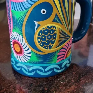 a colorful coffee mug