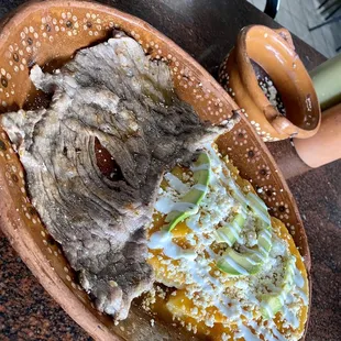 Entomatadas with a side of cecina (tomato sauce and aged beef)