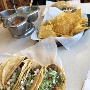 tacos and chips on a table