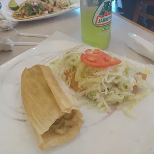 Chicken tamales and chicharron empanada.