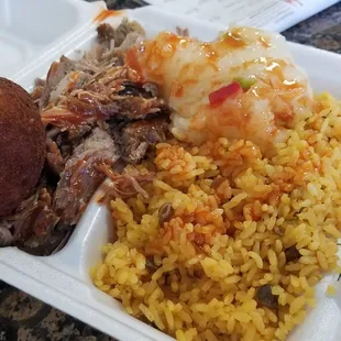 Pernil, rice, yuca and a papa rellena.