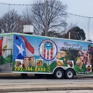 a food truck parked on the side of the road