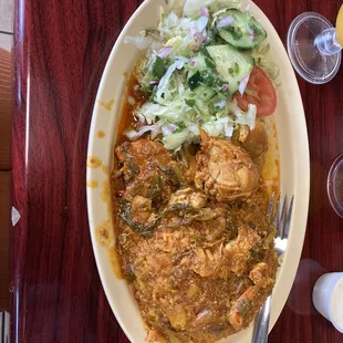 pollo guisado (stewed chicken) I believe Who cares..it was good as F$!k!!