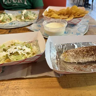 Mexican street corn(near dirty cloth) chicken soft tacos