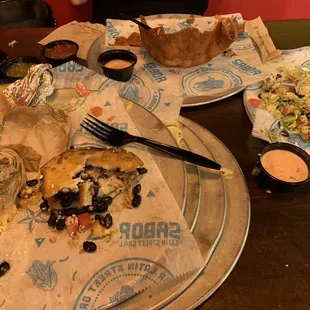 4 tacos, nachos and a salad bowl destroyed.