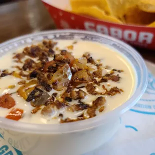 Large queso add Chorizo. Always order a large it comes with chips!!