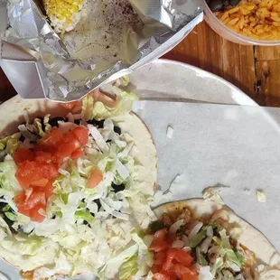 Some elote, a couple of tacos Americanos, and a side of rice and beans.