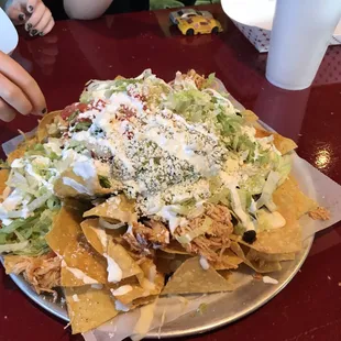 Supreme nachos.  A meal for two kids and an appetizer for two adults, which still left some.  Incredible taste and value.
