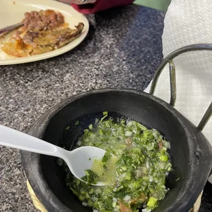 a pan of food with a spoon in it