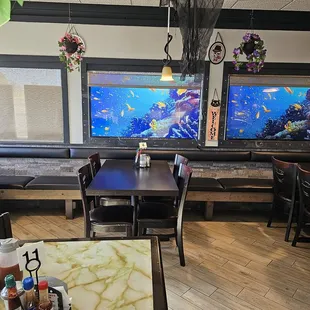 a dining area with tables and chairs