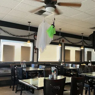 a dining area with tables and chairs