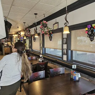 a woman standing in a restaurant