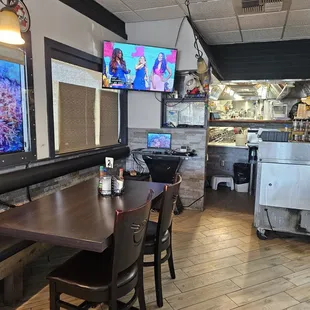 a dining area with tables and chairs