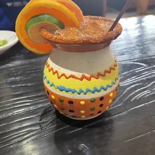 a colorful drink with a straw in it