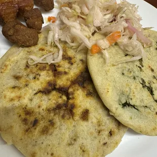 Pupusa de loroco, and pupusa de chicharrón. Also a side of chicharrón frito. And it comes with curtido, a pickled cabbage salad.