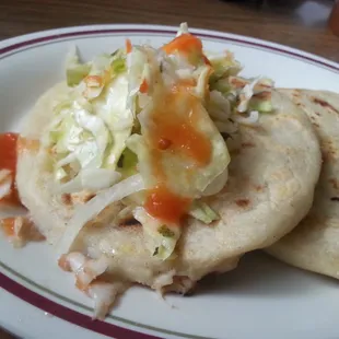 Pupusa with bean and cheese. And cracklins and cheese.