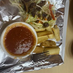 Yuca frita and chicharrones