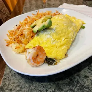an omelet with shrimp and vegetables