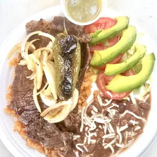 Carne asada with beans, avocados and Chile