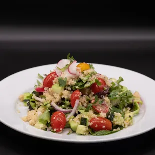 a white plate with a salad on it