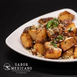 a plate of potatoes and broccoli