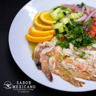 a plate of shrimp and vegetables