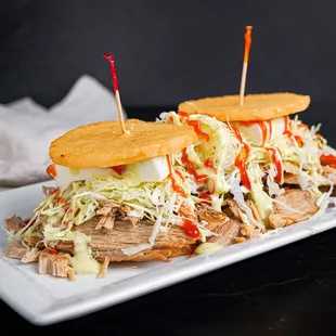 a pulled pork sandwich with cole slaw