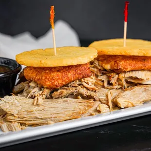 a pulled pork sandwich with cornbreads
