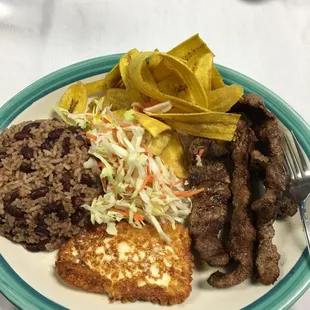 Steak, rice and beans, fried cheese, slaw, and fried plantains.