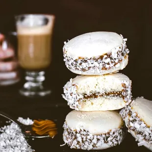 a stack of donuts and a cup of coffee