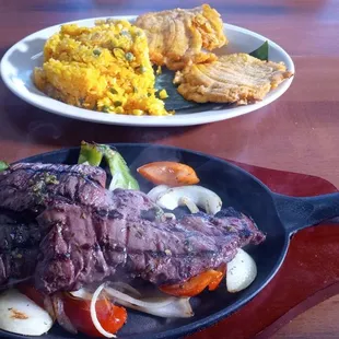 Skirt steak with veggies, yellow rice and plantains. Make sure to get the sauce.