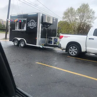 a truck pulling a food truck