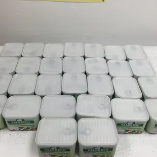 a stack of sabri food containers