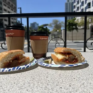 Meatball sandwhich with some coffee