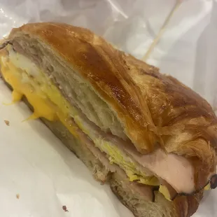 Croissant sandwich with ham, egg, and cheese. So yummy.