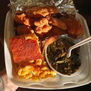 Fried chicken drumettes with mac and cheese and greens.  Side of corn bread