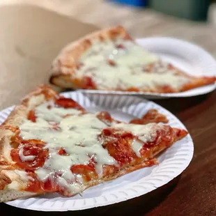 Pizza slices. We asked for them to be extra cheesy. So delicious!
