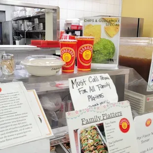 a woman behind a counter in a restaurant