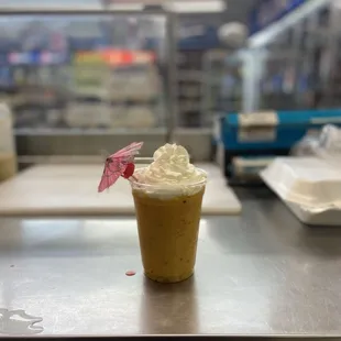 a cup of coffee with whipped cream