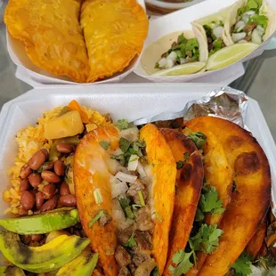 Front: Birria Tacos (Carne Asada).  Top left:  Empanadas. Top right: Street Tacos (Carne Asada).